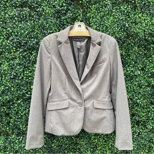 Grey wide leg pants suit with blazer and stretch material. Machine washable.
